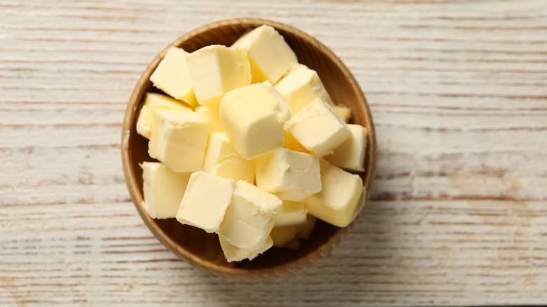 Cubed cold butter in a small wooden bowl