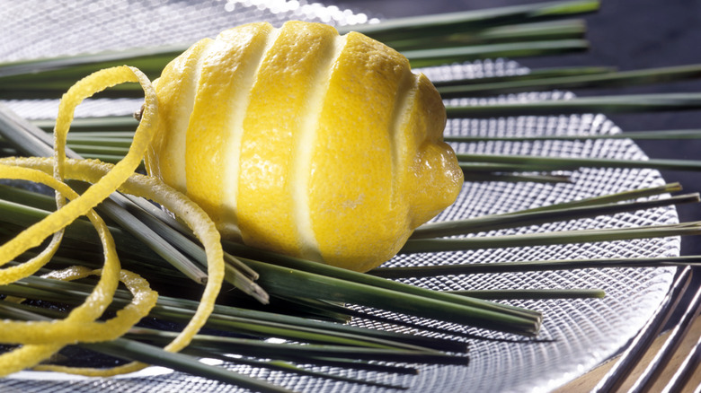 Lemon peel rind with lemon on plate