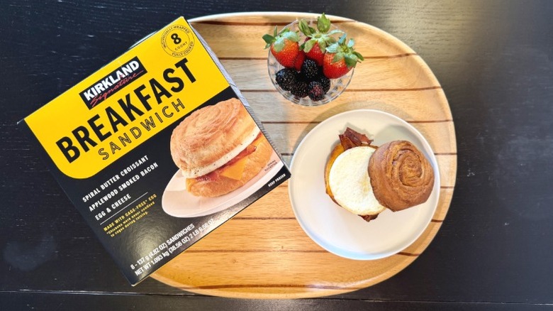 Kirkland Breakfast Sandwich on a plate next to its packaging and a bowl of berries