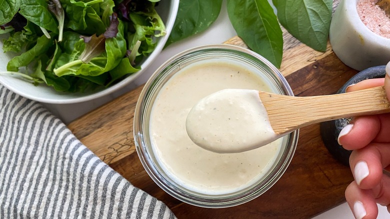 sauce in glass jar with spoon