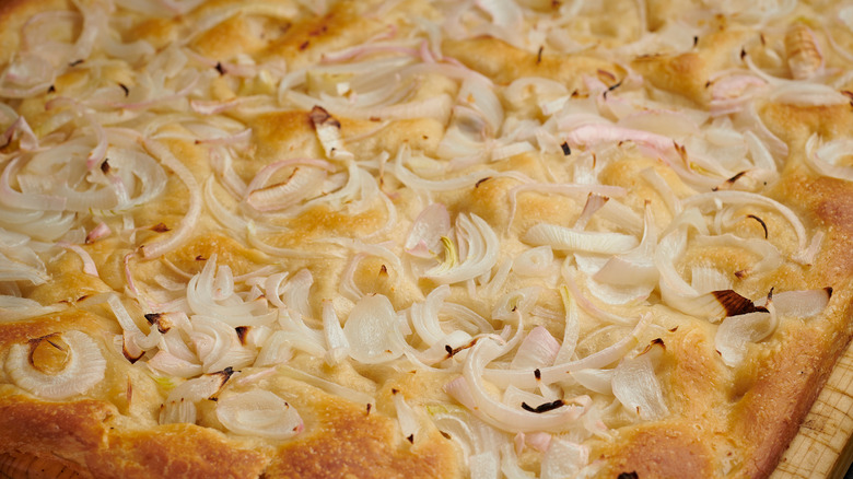 Sliced focaccia with red onions.