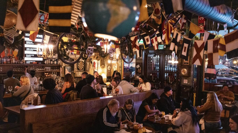 Jaquval pub photographed with visitors inside.