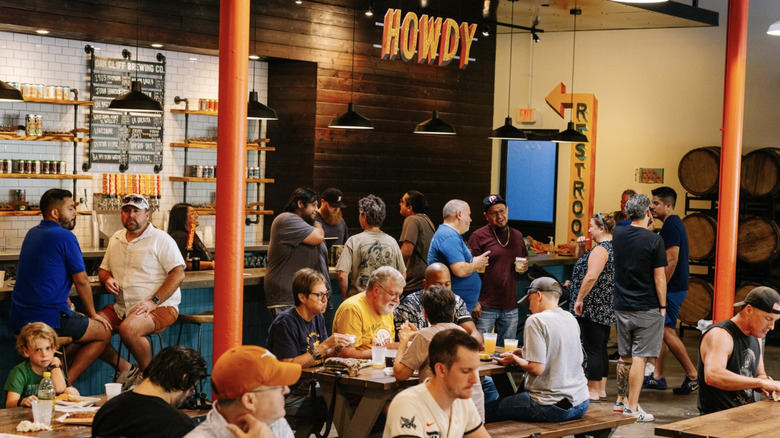 Interior of Oak Cliff Brewing filled with customers.