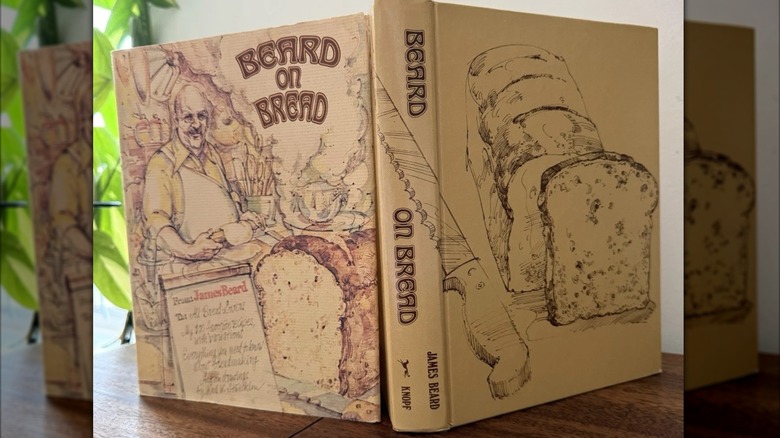 Two hardback copies of "Beard on Bread" sit propped up against each other.
