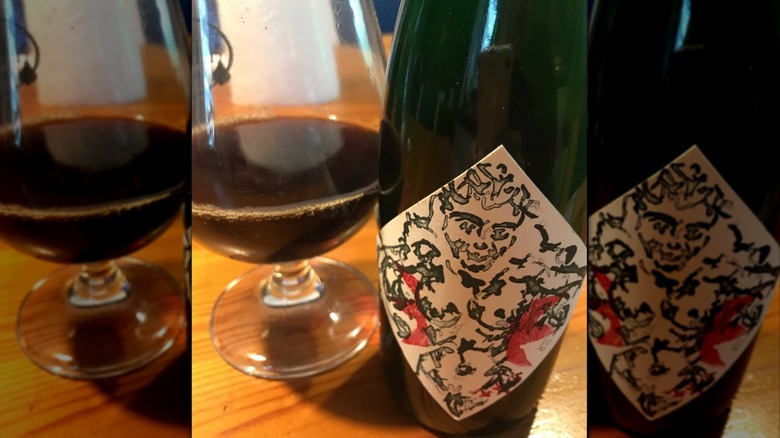A bottle and glass of Carlsberg Brewery Jacobsen Vintage.
