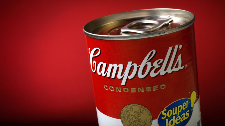 A can of Campbell's condensed soup against a red background