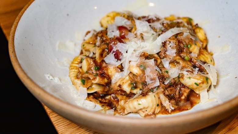 Su Pitzosu with red wine braised boar, grape, saba, and provolone del Monaco