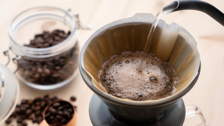 Water being poured into coffee grounds