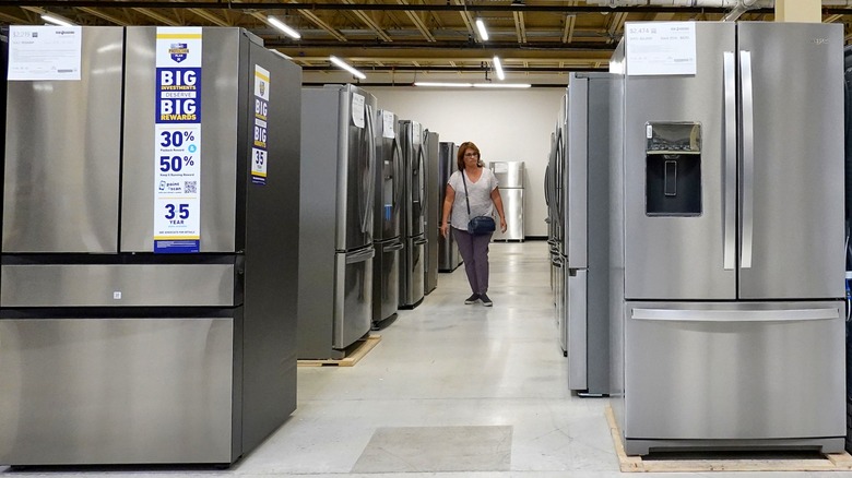 A shopper browses refrigerators for sale