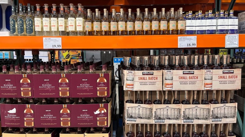 Different Costco whiskies on the shelf.