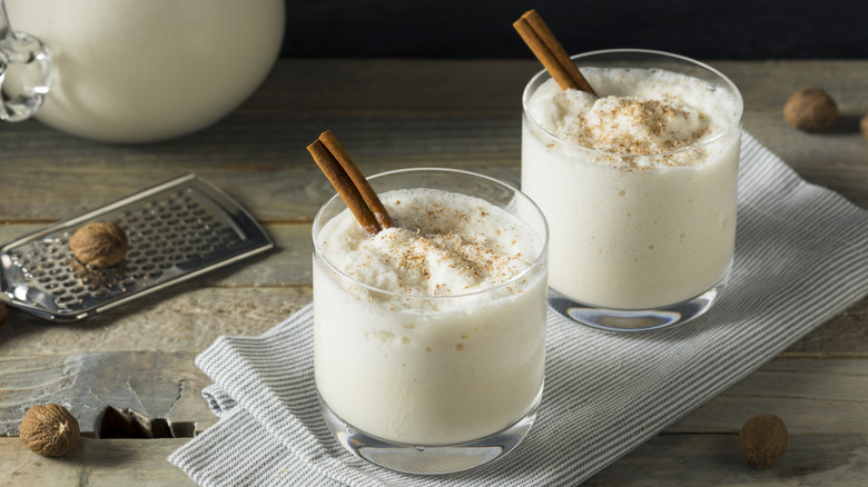 Bourbon milk punch with a cinnamon stick garnish.
