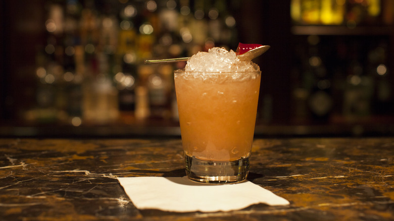 Cocktail with a spoon of jam