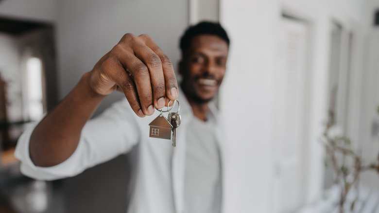 person holding house key