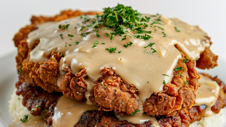 Plate of country fried steak with gravy