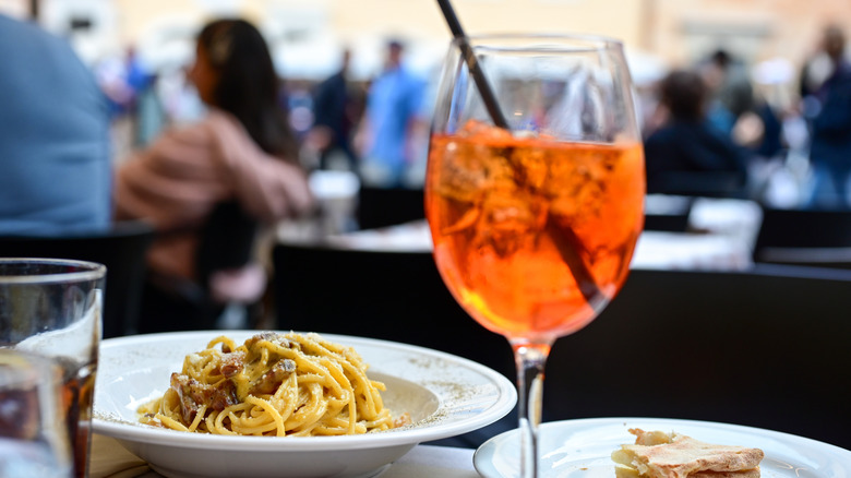 An Aperol Spritz and carbonara in Rome.
