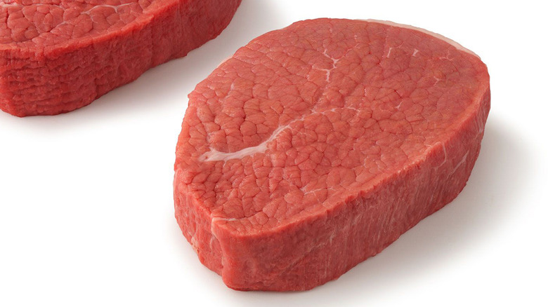 round steaks on white background