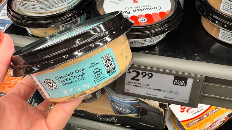 Person holds Chocolate Chip Cookie Dough Dessert Dip in the store