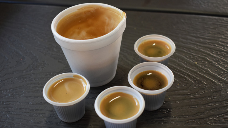 A Cuban-style colada coffee portioned out into 4 shots