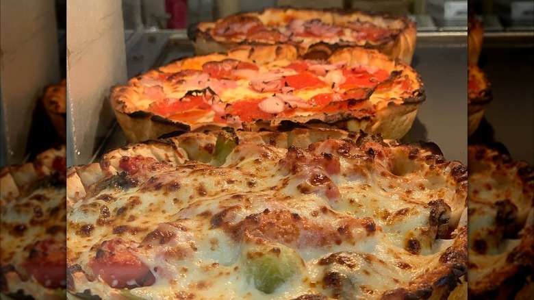 A close up of Reggio's deep dish single serve pizza