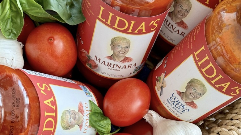 Basked of Lidia's sauces with basil, garlic, and tomatoes