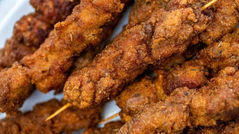 City chicken skewers on a plate