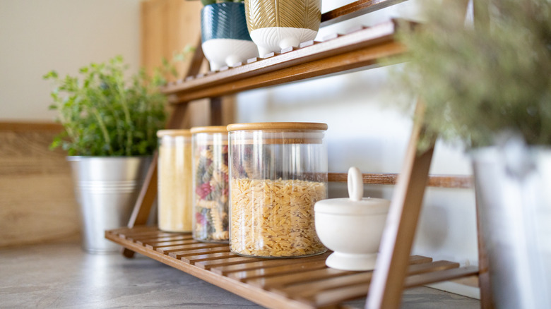 Small standing shelf for jars of dried goods