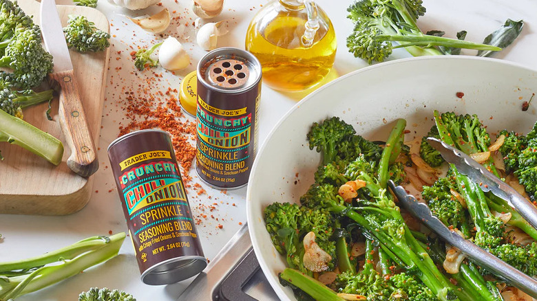 Jars of Trader Joe's Crunchy Chili Onion Sprinkle with cooked broccoli