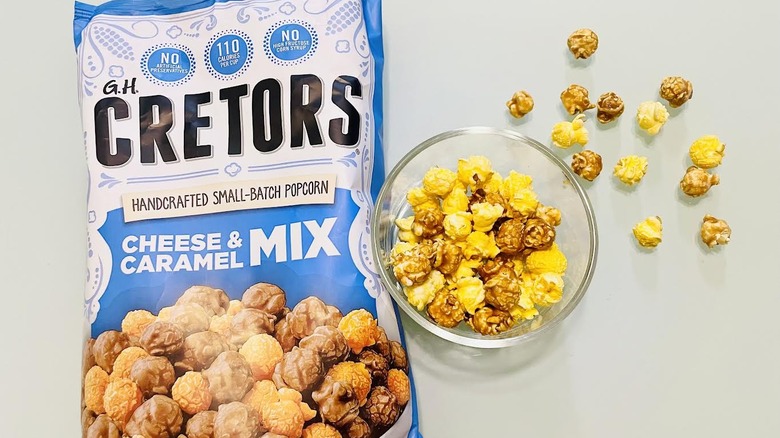 Bag of G.H. Cretors with dish of popcorn on side
