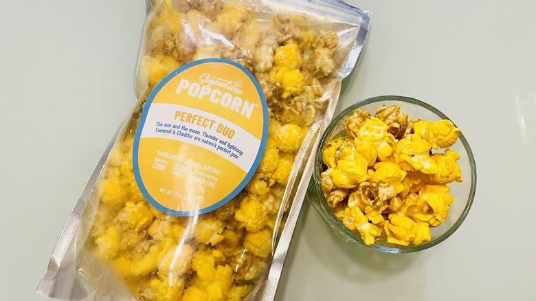 Bag of Signature Popcorn with small dish on side