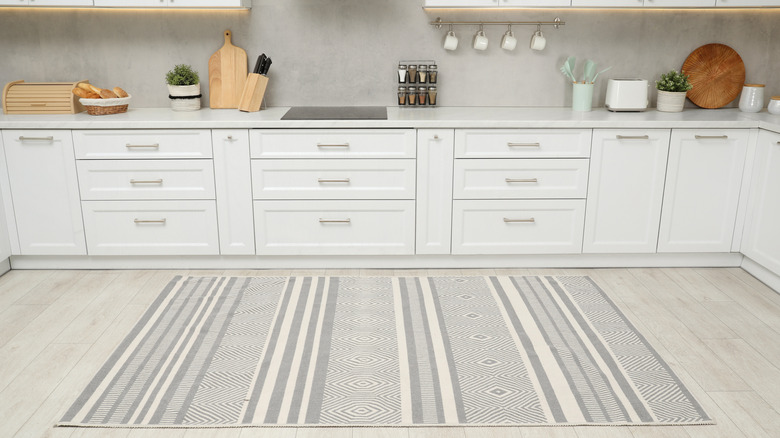 Bright kitchen space with a gray and white rug