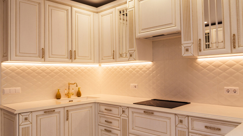 LED lights brightening up a white kitchen
