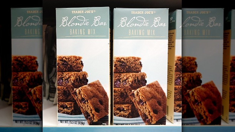 Rows of Trader Joe's Blondie Bar Baking Mix sit on the store's shelves