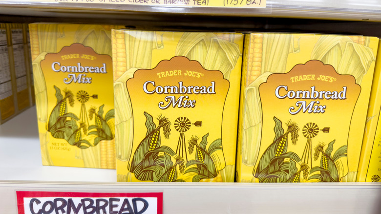 Rows of Trader Joe's Cornbread Mix sit on store shelves