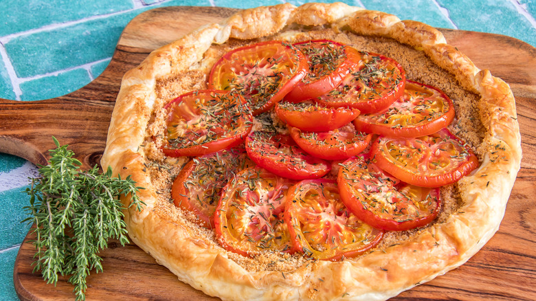 Tomato tart on cutting board