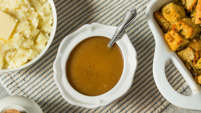 Gravy in a white ceramic dish