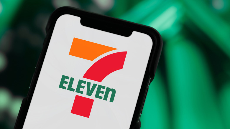 The 7-Eleven logo on a smartphone screen