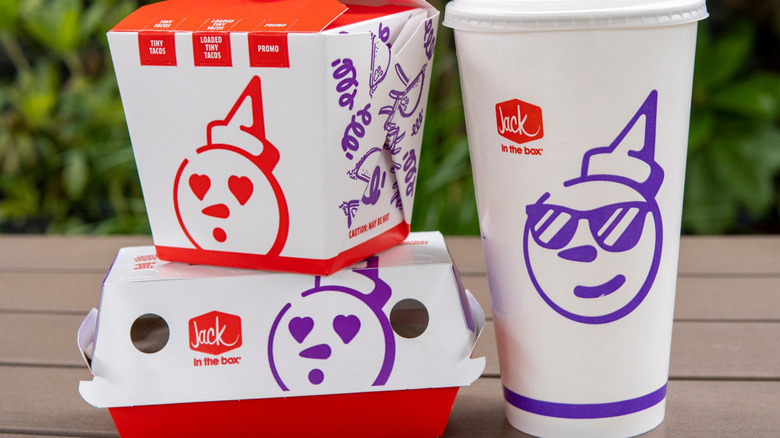 a Jack in the Box meal with drink on a wooden table