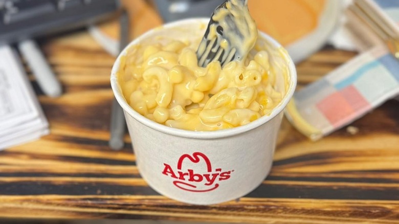 arby's mac and cheese on desk with fork
