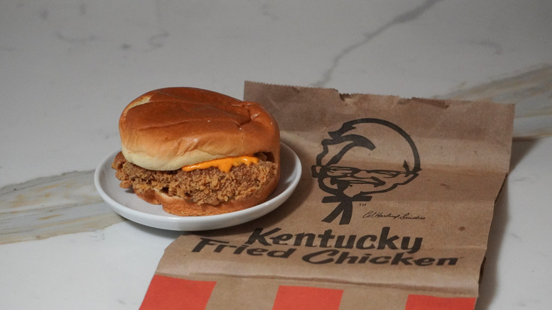 KFC Spicy Chicken Sandwich on a Kentucky Fried Chicken brown paper bag.