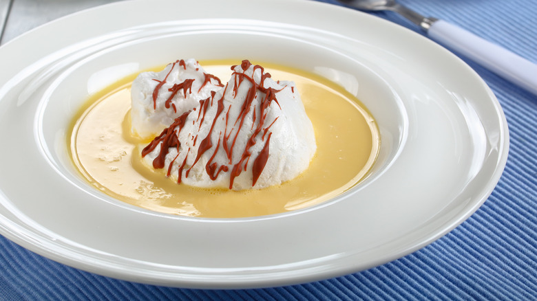 floating islands with caramel drizzle on a white plate