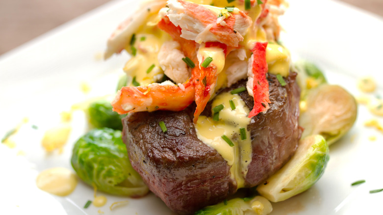 steak Oscar with crab meat hollandaise and brussels sprouts