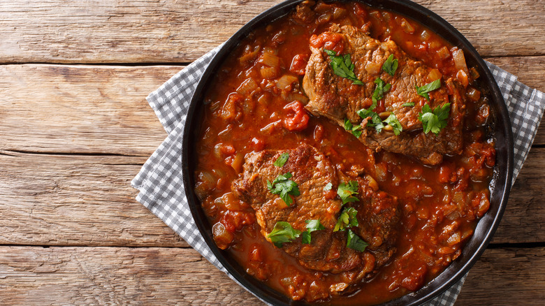 swiss steak in pan with garnish