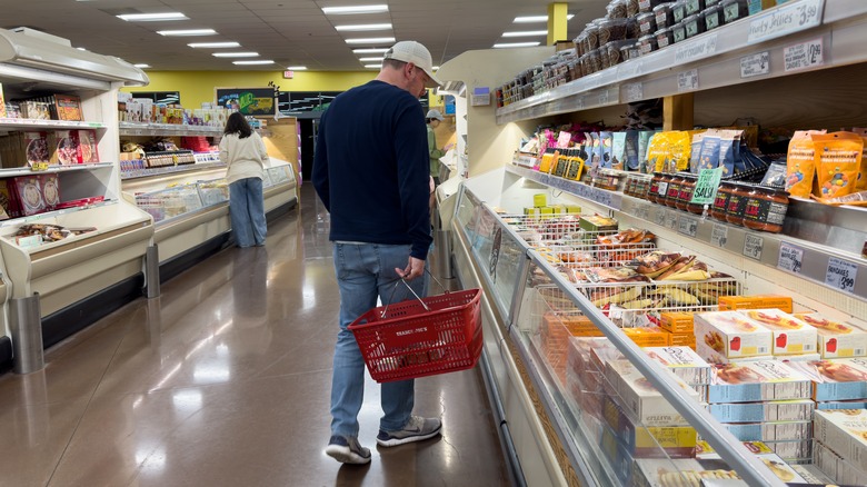 man shopping at Trader Joe's freezer aisle
