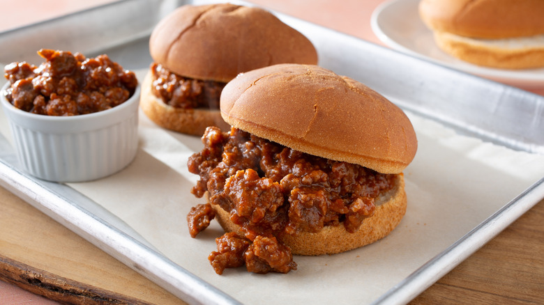 Two sloppy joes on a diner tray on gluten-free buns