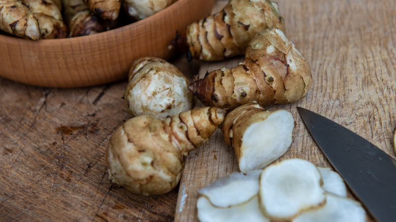 Jerusalem artichokes sliced on a cutting board