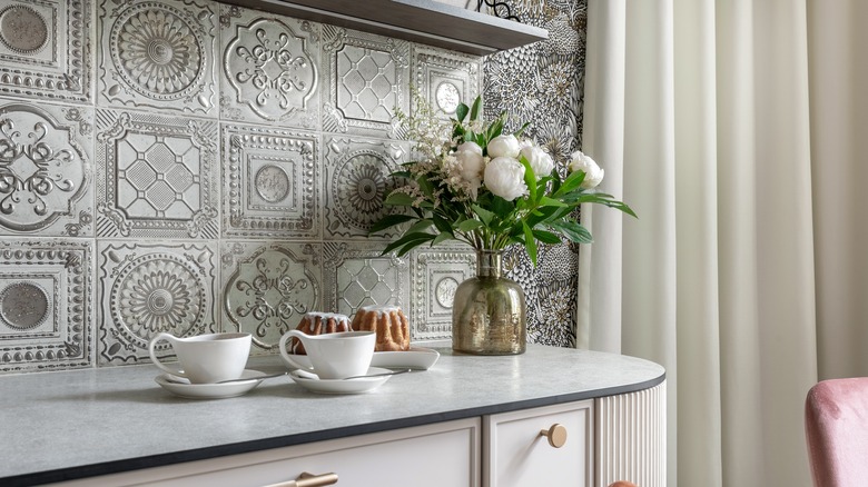 Ornate textured gray kitchen backsplash