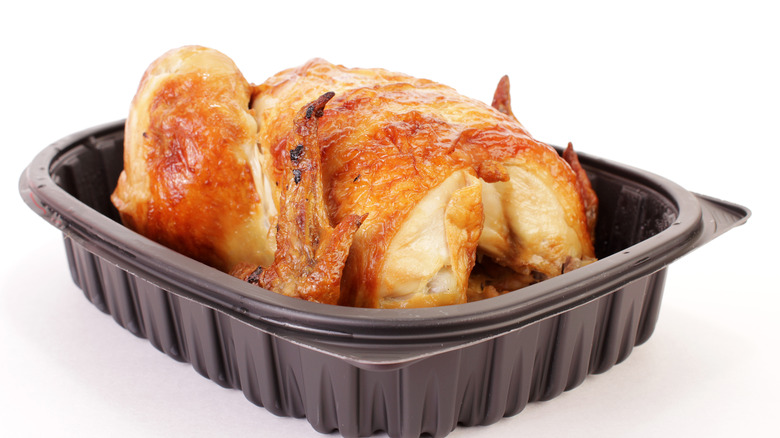 a rotisserie chicken in a plastic container