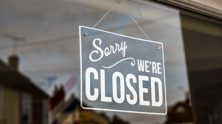 Closed sign in restaurant window