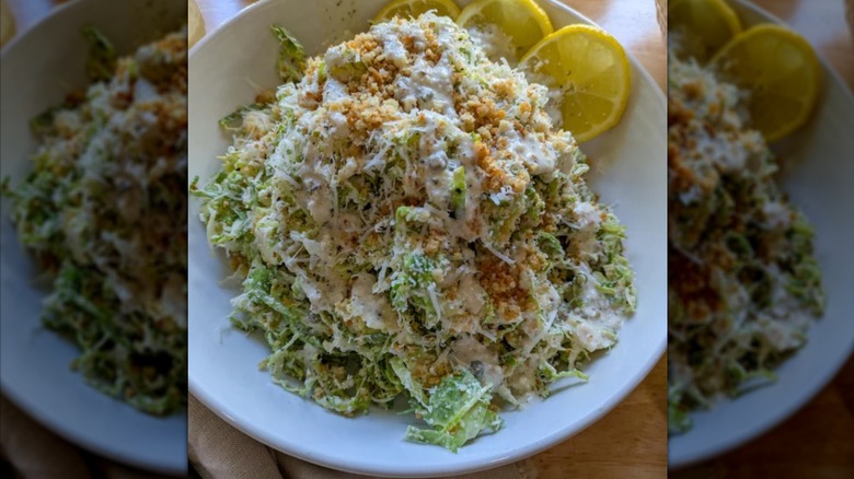 a bowl of shaved Brussels sprout salad with bread crumbs