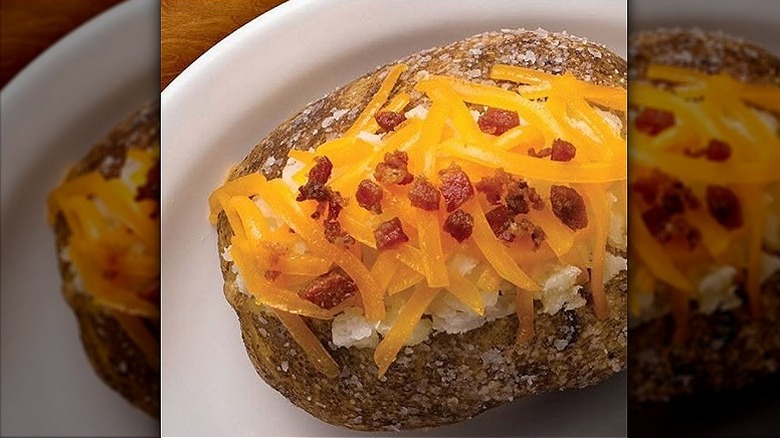Closeup of a loaded baked potato at Texas Roadhouse